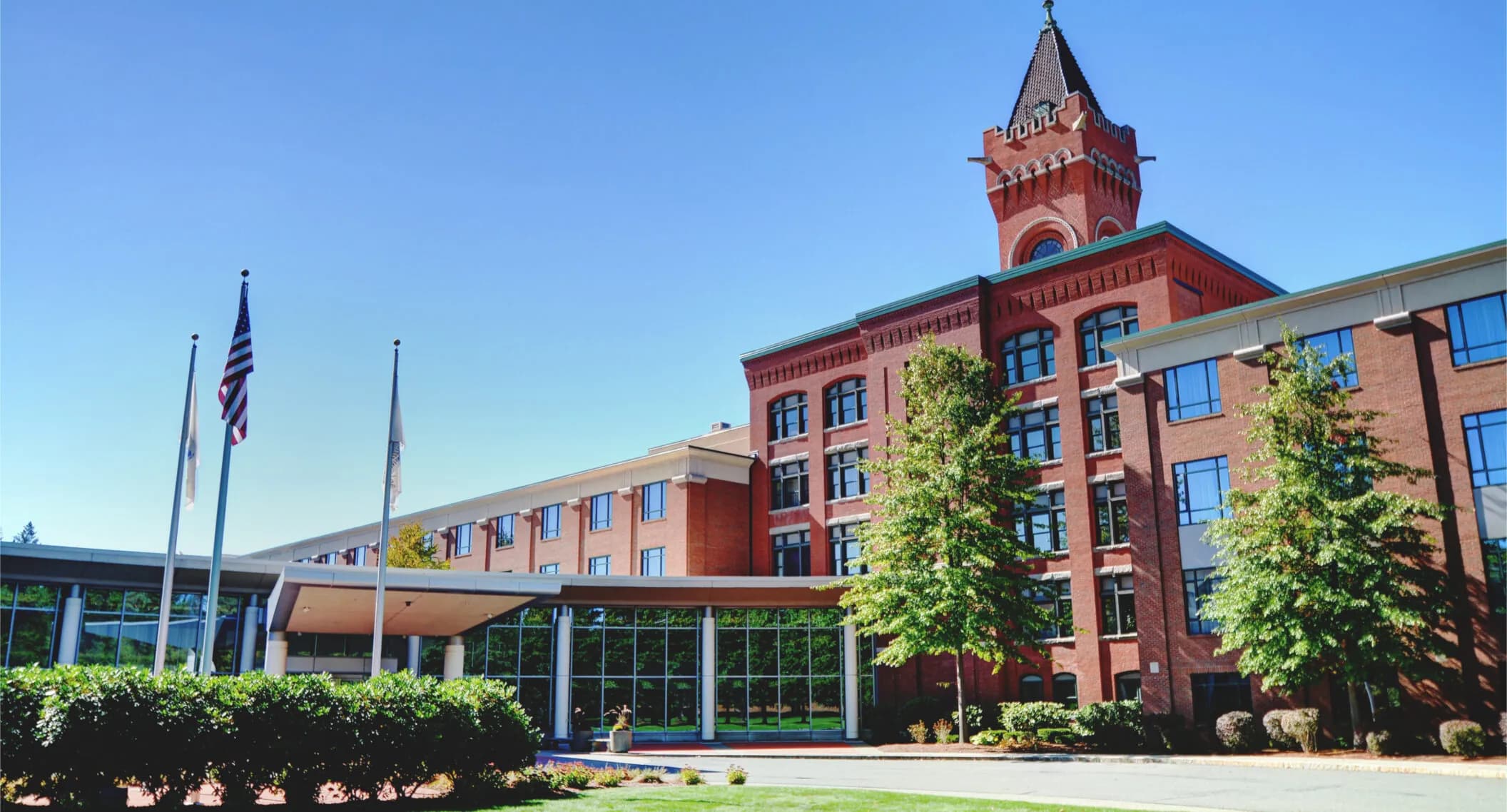 Exterior of the Wellsworth Hotel, showing the entrance canopy and clock tower